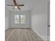 Bedroom featuring a ceiling fan and closet along with two windows for natural light at 56 Linneys Mountain Rd, Taylorsville, NC 28681