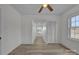 Bright bedroom features modern flooring, fresh white walls, and ceiling fan at 56 Linneys Mountain Rd, Taylorsville, NC 28681