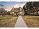 Charming two-story home features a welcoming walkway and well-maintained front yard at 56 Linneys Mountain Rd, Taylorsville, NC 28681