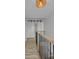 Hallway with barn doors and wood and metal railing, showcasing modern design elements at 56 Linneys Mountain Rd, Taylorsville, NC 28681