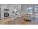 Open kitchen with white cabinetry, stainless steel appliances, and a dining table and chairs at 56 Linneys Mountain Rd, Taylorsville, NC 28681