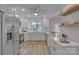 Updated kitchen featuring stainless steel appliances, white cabinets, and lots of natural light at 56 Linneys Mountain Rd, Taylorsville, NC 28681