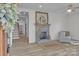 Bright living room with a decorative fireplace, ceiling fan and modern flooring at 56 Linneys Mountain Rd, Taylorsville, NC 28681