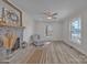 Spacious living room with a decorative brick fireplace and plenty of natural light at 56 Linneys Mountain Rd, Taylorsville, NC 28681