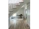 Bright office space with modern desk, hardwood floors, staircase, and natural light from the large window at 56 Linneys Mountain Rd, Taylorsville, NC 28681