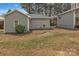 Multiple small outbuildings are featured in the grassy backyard at 56 Linneys Mountain Rd, Taylorsville, NC 28681