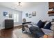 Stylish bedroom features hardwood floors, a large dresser, and light-blue walls at 618 Bannerman Ln, Fort Mill, SC 29715