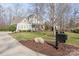 Beautiful home with well-manicured lawn and landscaping with a view from the driveway at 618 Bannerman Ln, Fort Mill, SC 29715