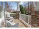 Relaxing front porch with white rocking chairs and a stone pillar at 618 Bannerman Ln, Fort Mill, SC 29715