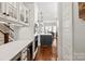 Modern kitchen featuring a gray island, stainless steel appliances, and hardwood floors at 618 Bannerman Ln, Fort Mill, SC 29715