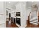 Bright kitchen with white cabinets, stainless steel appliances, and hardwood floors at 618 Bannerman Ln, Fort Mill, SC 29715
