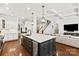 Open-concept kitchen with large island, stainless steel appliances, and hardwood flooring at 618 Bannerman Ln, Fort Mill, SC 29715