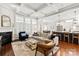 Bright, open-concept living room with fireplace, modern furniture, and views into the gourmet kitchen at 618 Bannerman Ln, Fort Mill, SC 29715
