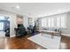 Open living room with gray walls, white trim, and dark wood floors at 618 Bannerman Ln, Fort Mill, SC 29715