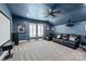 Home theater with blue walls, projector, screen, and comfortable seating at 618 Bannerman Ln, Fort Mill, SC 29715