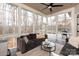 Inviting sun room featuring large windows, vaulted ceiling, and comfortable seating at 618 Bannerman Ln, Fort Mill, SC 29715