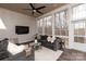 Inviting sun room featuring large windows, vaulted ceiling, and comfortable seating at 618 Bannerman Ln, Fort Mill, SC 29715