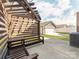 Cozy backyard featuring a pergola with built-in seating at 6332 Kennard Dr, Charlotte, NC 28216