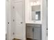Bathroom featuring a gray vanity with modern fixtures at 6332 Kennard Dr, Charlotte, NC 28216