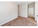 Neutral bedroom with plush carpeting, a bright interior, and an en-suite bathroom at 6332 Kennard Dr, Charlotte, NC 28216
