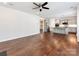 Open-concept living space featuring hardwood floors and seamless flow into the modern kitchen at 6332 Kennard Dr, Charlotte, NC 28216