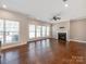 Spacious living room with hardwood floors, fireplace, and abundant natural light at 6332 Kennard Dr, Charlotte, NC 28216