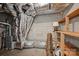 Unfinished basement featuring the home's HVAC system and block-wall construction at 6366 Sharon Hills Rd, Charlotte, NC 28210
