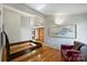 Bright bedroom with hardwood floors, ensuite bathroom, and decorative art on the wall at 6366 Sharon Hills Rd, Charlotte, NC 28210
