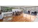 Dining room features large windows, hardwood floors, and outside access at 6366 Sharon Hills Rd, Charlotte, NC 28210