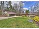 Sprawling single-story home featuring a long driveway, carport and mature trees at 6366 Sharon Hills Rd, Charlotte, NC 28210