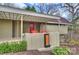 Home featuring a covered porch with red outdoor seating and a red door at 6366 Sharon Hills Rd, Charlotte, NC 28210