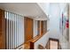 Bright hallway with paneled walls, recessed lighting, and a wooden railing at 6366 Sharon Hills Rd, Charlotte, NC 28210