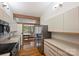 Bright kitchen with stainless appliances, view of dining, and hardwood floors at 6366 Sharon Hills Rd, Charlotte, NC 28210