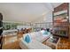Open-concept living area with stone fireplace, modern furniture and a dining area at 6366 Sharon Hills Rd, Charlotte, NC 28210