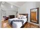 Spacious main bedroom with large window, dresser, and decorative mirror at 6366 Sharon Hills Rd, Charlotte, NC 28210