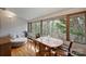 Cozy sitting area with view of treeline and table for intimate setting at 6366 Sharon Hills Rd, Charlotte, NC 28210