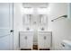 Modern bathroom with double vanities and sleek fixtures at 66 Reed Ne St, Concord, NC 28025