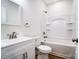 Bathroom featuring shower/tub combo and white vanity at 66 Reed Ne St, Concord, NC 28025