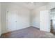 Bedroom features carpet, neutral paint, and two doors at 66 Reed Ne St, Concord, NC 28025