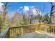 New wooden deck, perfect for outdoor enjoyment, with views of the lush greenery in the backyard at 66 Reed Ne St, Concord, NC 28025