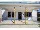 Covered front porch of a home with white siding, black windows, and a sleek black front door at 66 Reed Ne St, Concord, NC 28025