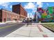 Downtown street with colorful murals and brick sidewalks at 66 Reed Ne St, Concord, NC 28025