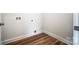 The utility room includes laminate flooring and washer and dryer hookups for convenience at 66 Reed Ne St, Concord, NC 28025