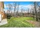 Expansive backyard with lush green grass and mature trees, perfect for outdoor activities at 7224 St Clair Dr, Charlotte, NC 28270