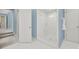 Modern bathroom featuring a glass-enclosed shower, neutral tones, and an adjacent open hallway at 7224 St Clair Dr, Charlotte, NC 28270