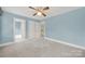 Spacious carpeted bedroom with attached closets and an ensuite bathroom at 7224 St Clair Dr, Charlotte, NC 28270