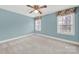 Carpeted bedroom with natural light through the two windows at 7224 St Clair Dr, Charlotte, NC 28270