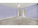 Bedroom features neutral carpet and an adjoining closet and doorway at 7224 St Clair Dr, Charlotte, NC 28270