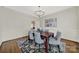 Elegant dining room featuring hardwood floors, modern chandelier, and wainscoting at 7224 St Clair Dr, Charlotte, NC 28270