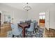 Stylish dining room featuring hardwood floors, seating for six, and modern decor at 7224 St Clair Dr, Charlotte, NC 28270
